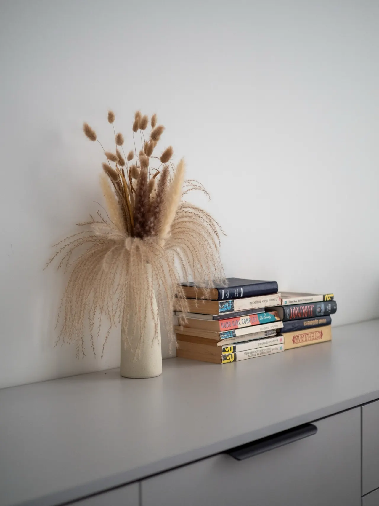 Reading corner with a curated book stack
