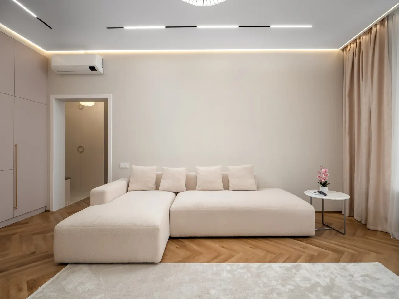Long modular sofa along the feature wall