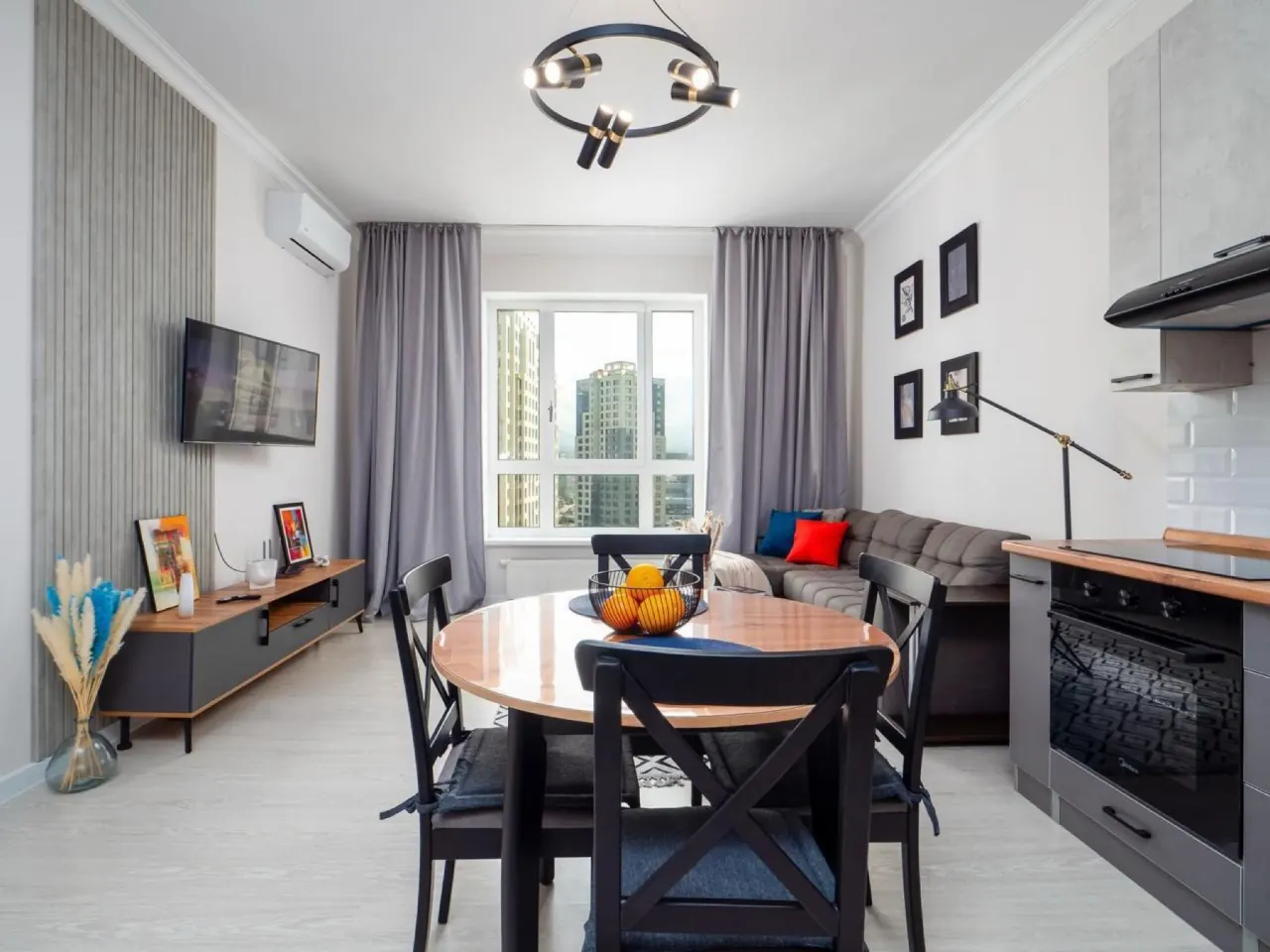 Living and dining room with round wooden table
