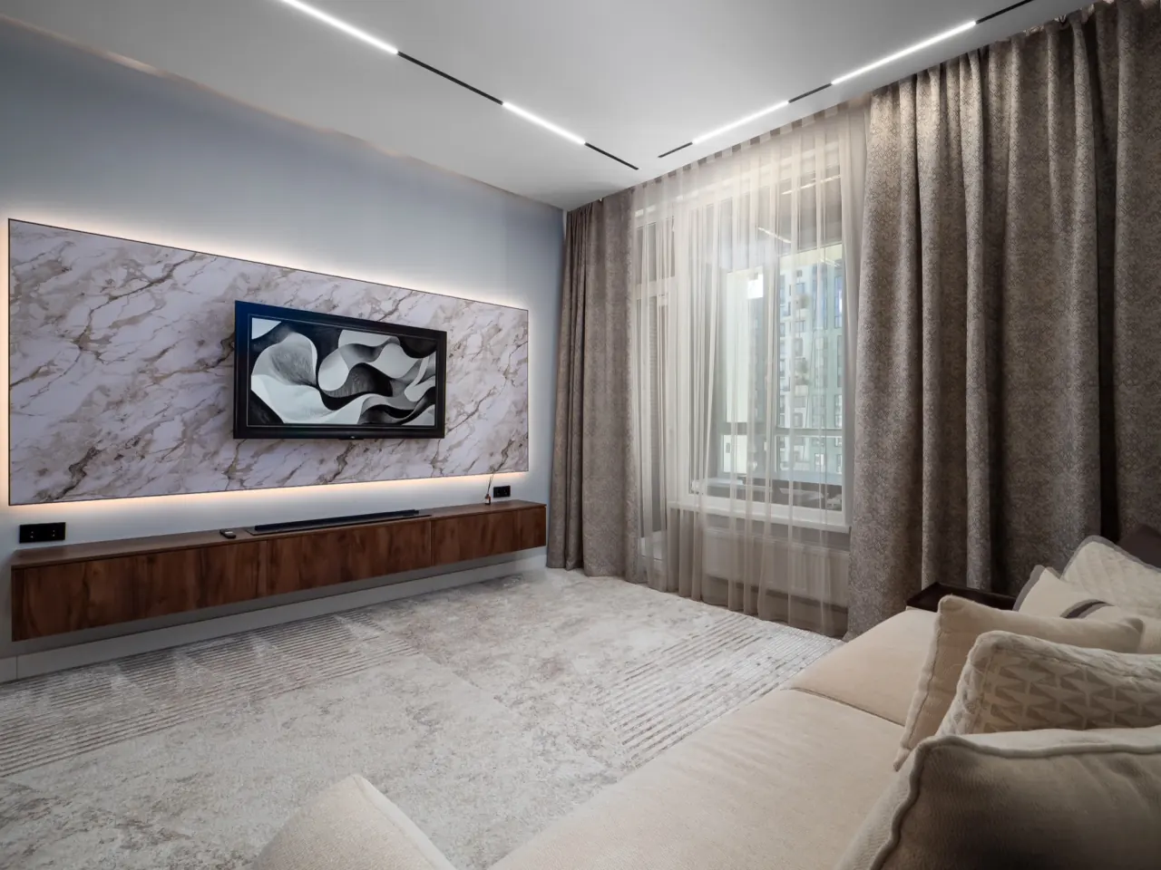 Lounge with walnut joinery and linear lighting