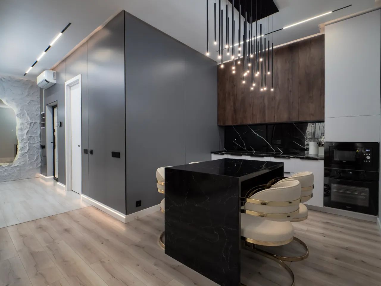 Black stone kitchen island with pendant lights