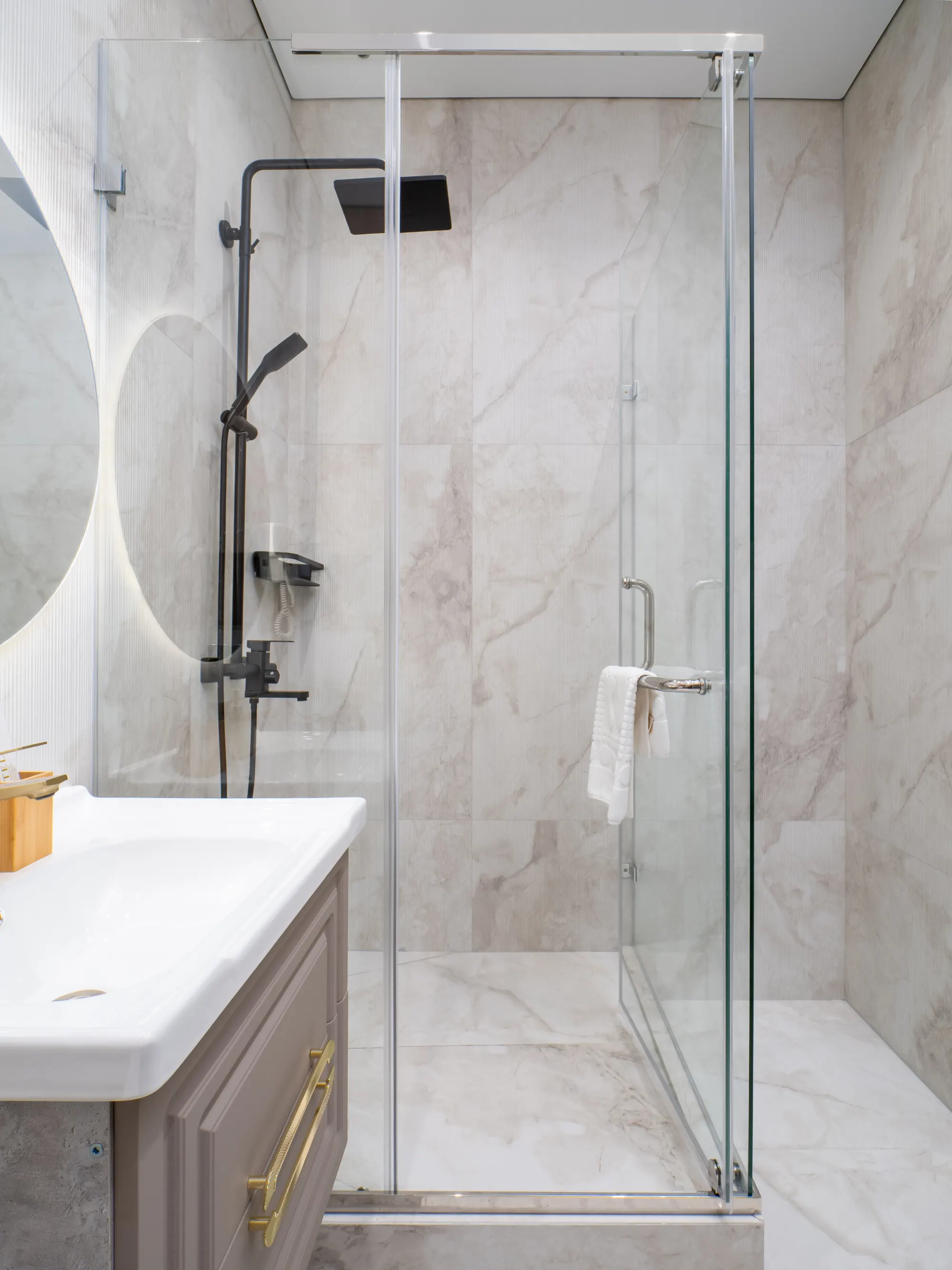 Rain shower detail in the marble bathroom
