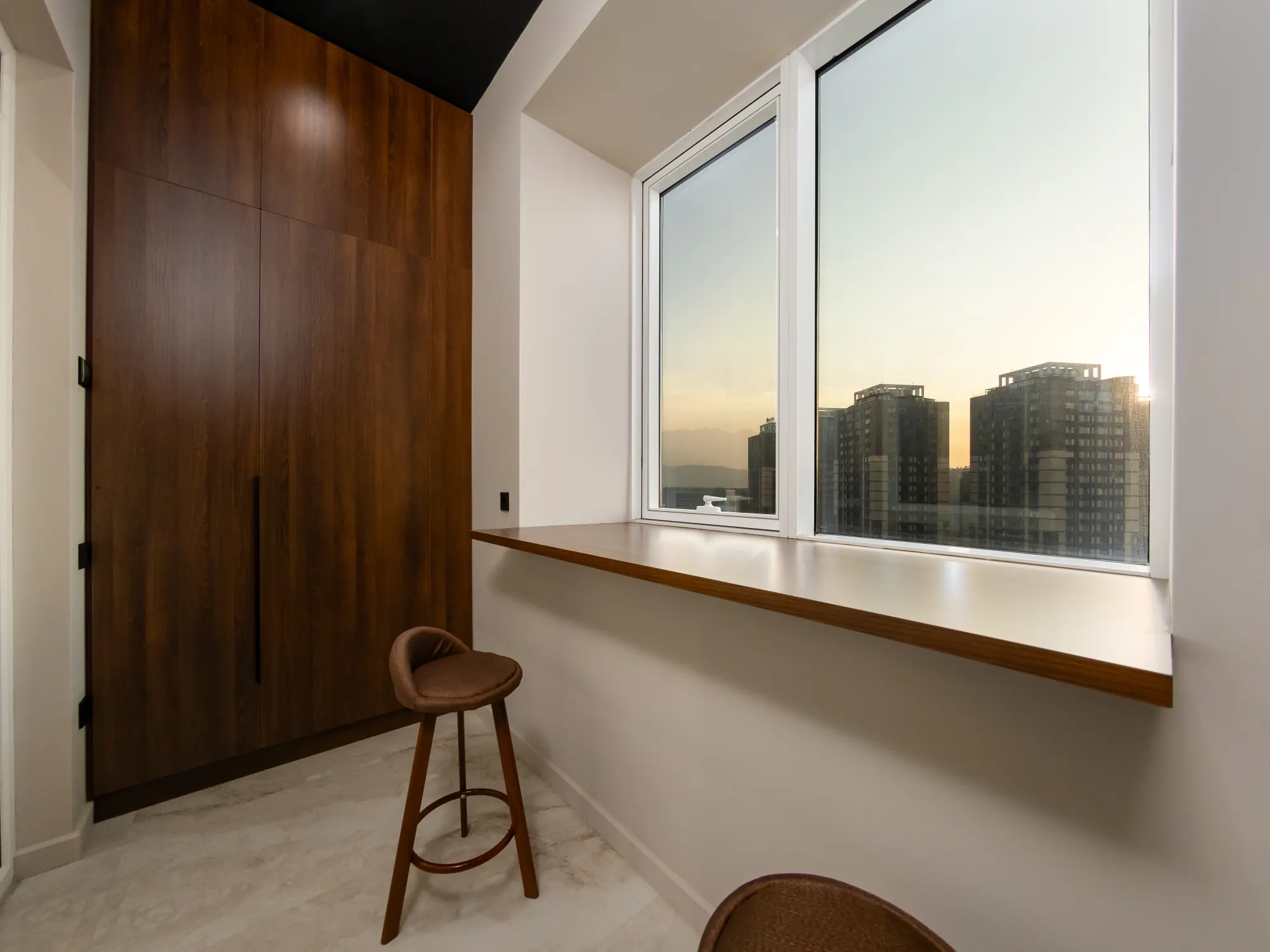 Panoramic window counter with bar stool