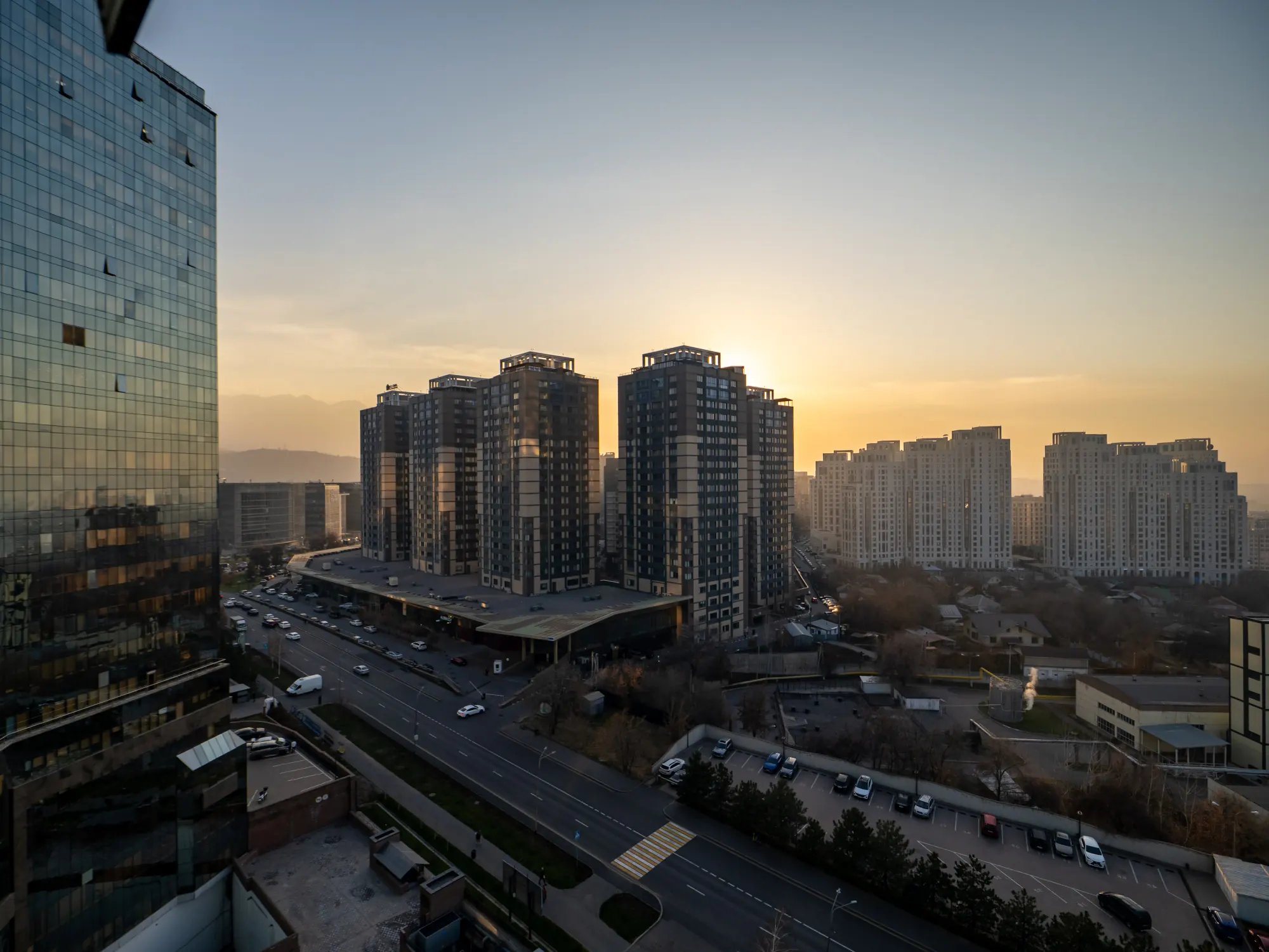 Sunset over Almaty seen from an upper-floor apartment